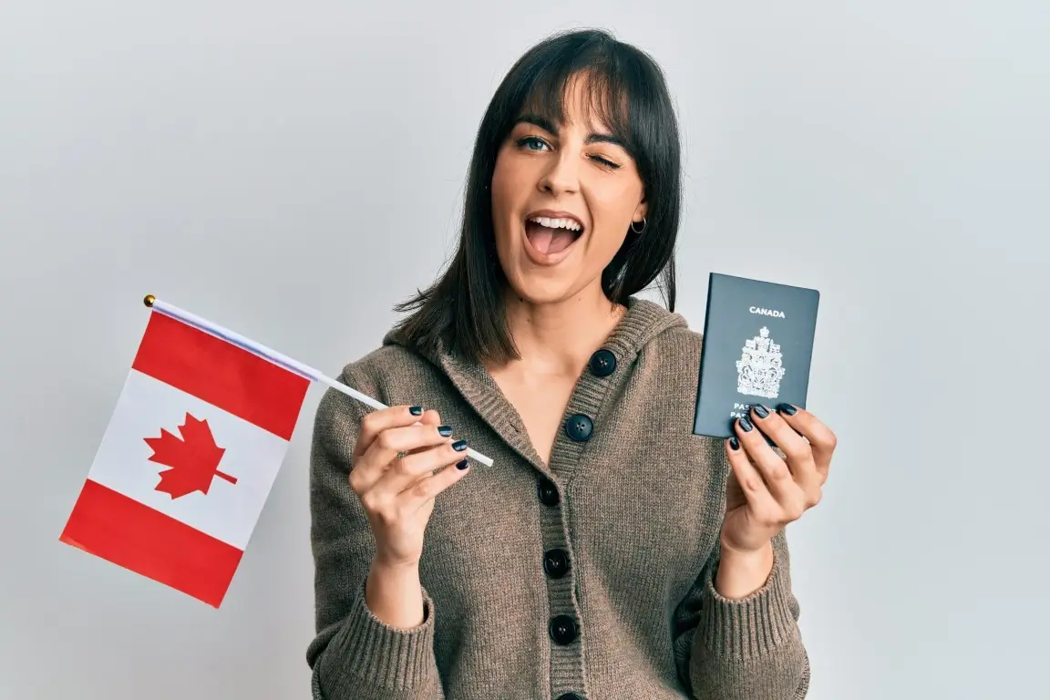 young-hispanic-woman-holding-canada-flag-passport-winking-looking-camera-with-sexy-expression-cheerful-happy-face_839833-22704 (Medium)